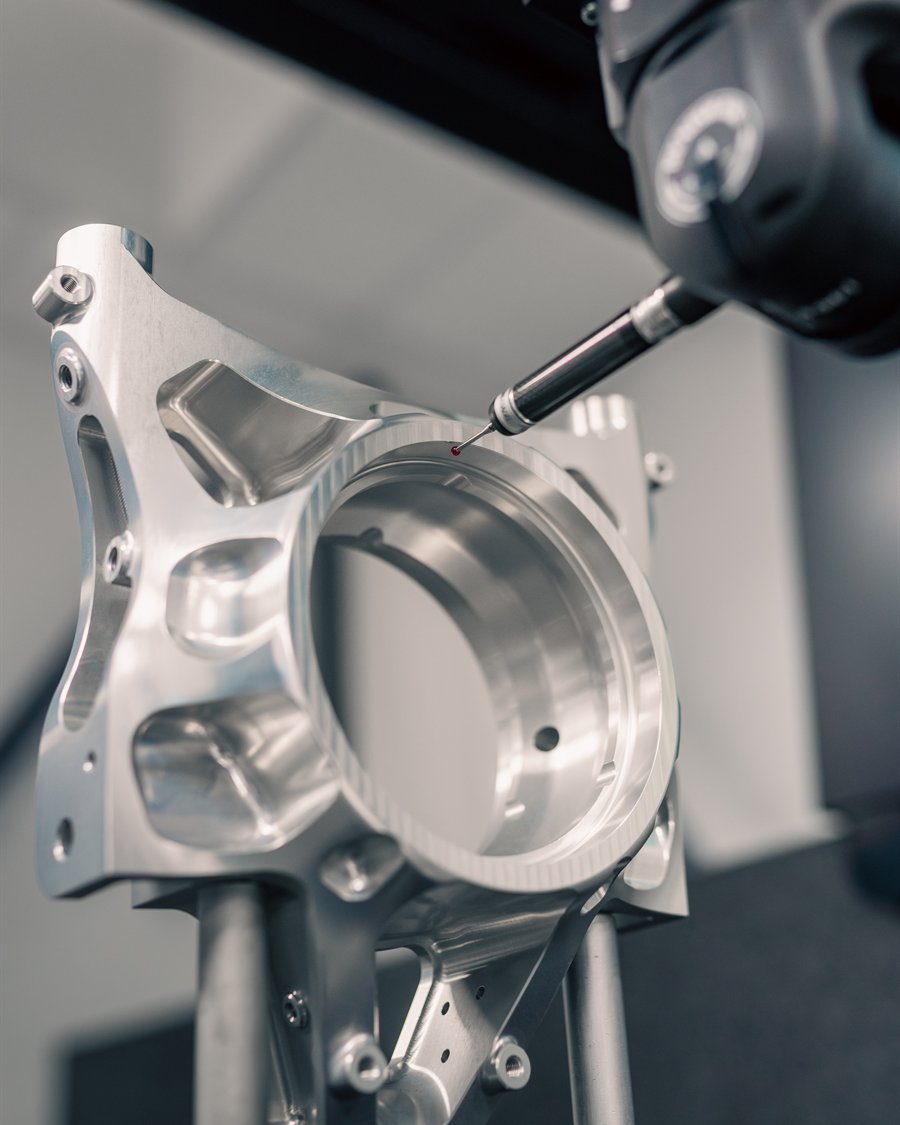 McMurtry machined aluminium upright — touch trigger probe inspection